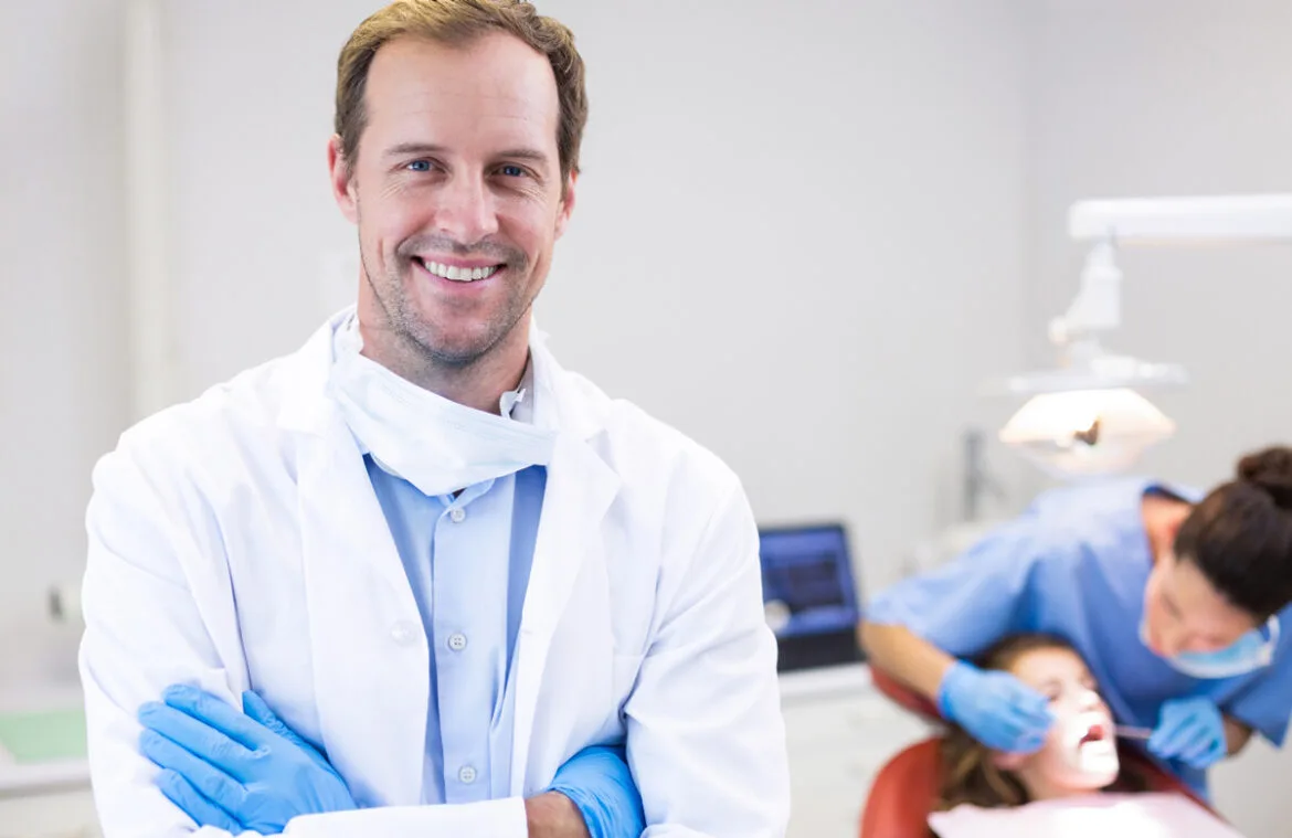 Simpladent Clinics Visakhapatnam - Dental Bridges dentist standing with arms crossed clinic